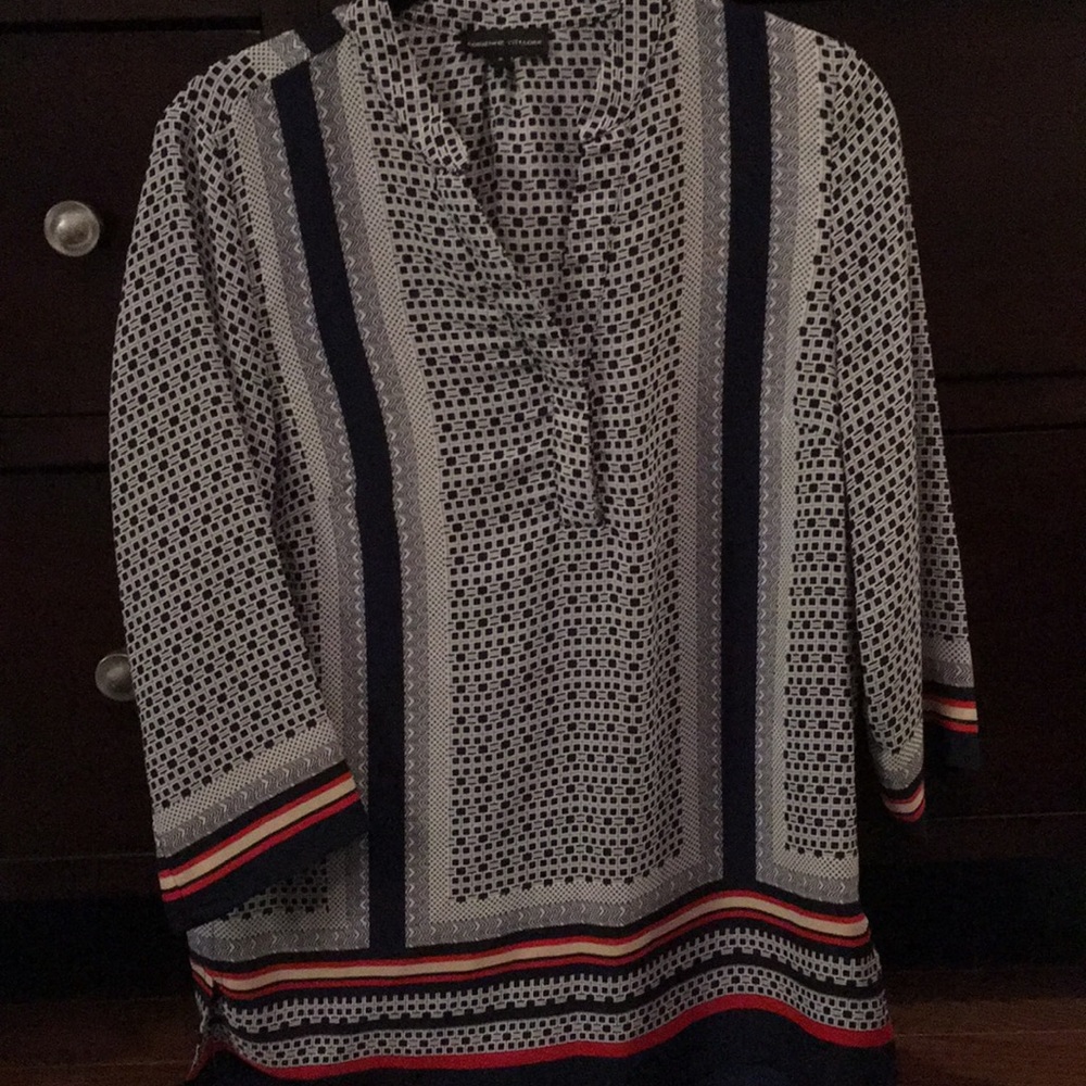 A super cute patterned blouse with an open v-neck!